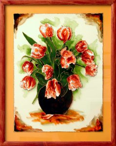 obraz przedstawiający wazom z czerwonymi tulipanami.