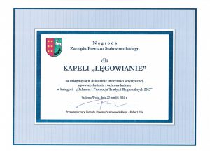dyplom nagroda zarządu powiatu stalowolskiego dla kapeli Łęgowianie za osiągnięcia w dziedzinie twórczości artystycznej i ochrony kultury.
